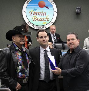 Alligator Ron Bergeron (L) and J.R. Bergeron (R) of Bergeron Emergency Services accept an Exemplary Service award from the Dania Beach Director of Public Services Brad Kaine.